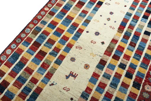Backside of handmade 2000s Persian Gabbeh rug showing knot structure and weave density