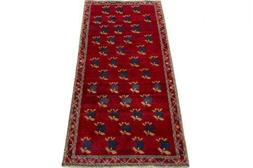 Surface texture of 2000s Persian Gabbeh rug with natural Wool and intricate pattern