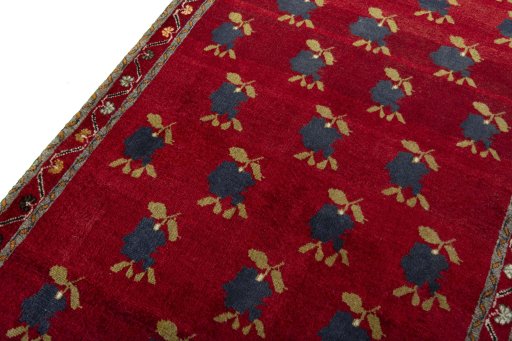 Backside of handmade 2000s Persian Gabbeh rug showing knot structure and weave density