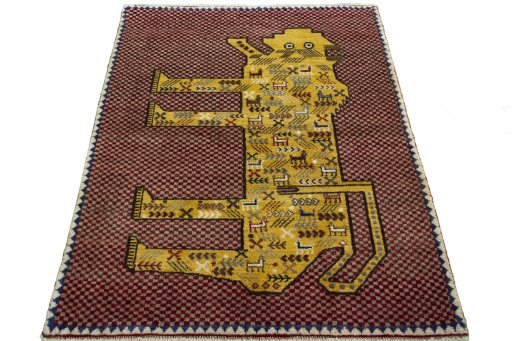 Surface texture of 2000s Persian Gabbeh rug with natural Wool and intricate pattern