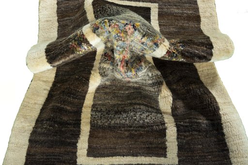 Corner detail of New Persian Gabbeh rug showing border pattern and Wool pile