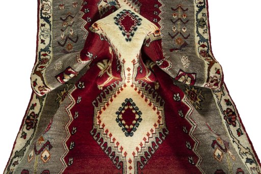 Corner detail of 2000s Persian Gabbeh rug showing border pattern and Wool pile