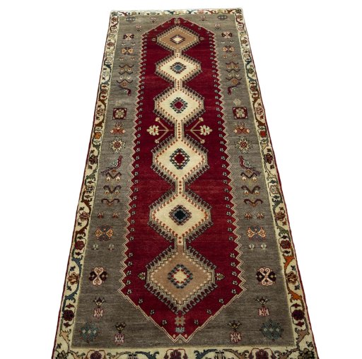 Surface texture of 2000s Persian Gabbeh rug with natural Wool and intricate pattern