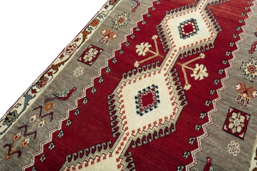 Backside of handmade 2000s Persian Gabbeh rug showing knot structure and weave density