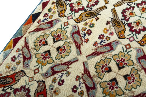 Backside of handmade 2000s Persian Gabbeh rug showing knot structure and weave density