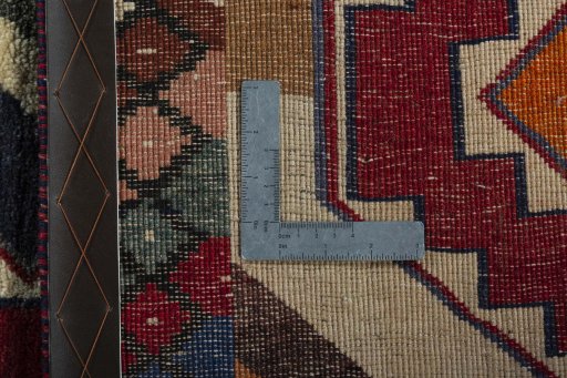 Surface texture of 2000s Persian Gabbeh rug with natural Wool and intricate pattern