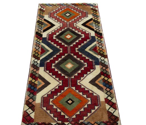 Surface texture of 2000s Persian Gabbeh rug with natural Wool and intricate pattern
