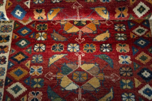 Full view of 2000s Persian Gabbeh rug from Iran / Persia, 190 × 130 cm in Red tones