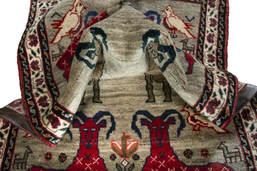 Corner detail of 2000s Persian Gabbeh rug showing border pattern and Wool pile