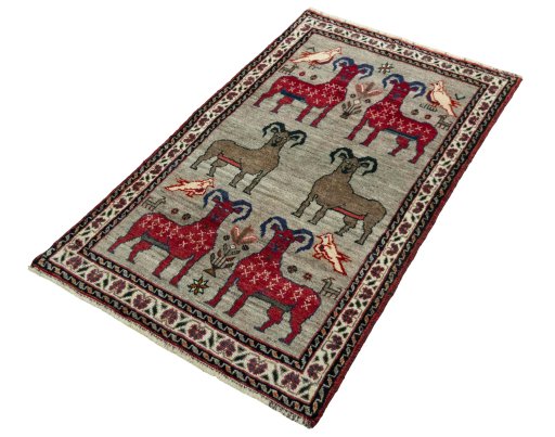 Corner detail of 2000s Persian Gabbeh rug showing border pattern and Wool pile