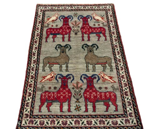 Surface texture of 2000s Persian Gabbeh rug with natural Wool and intricate pattern