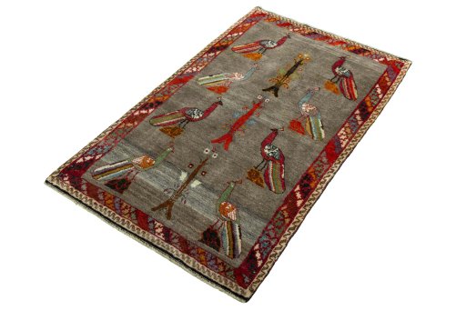 Corner detail of 2000s Persian Gabbeh rug showing border pattern and Wool pile