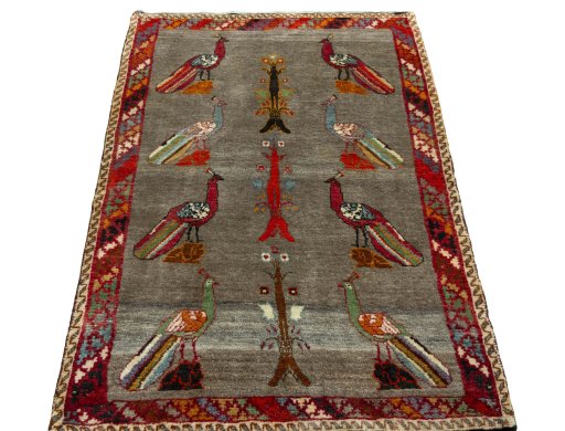 Surface texture of 2000s Persian Gabbeh rug with natural Wool and intricate pattern