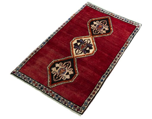Corner detail of 2000s Persian Gabbeh rug showing border pattern and Wool pile