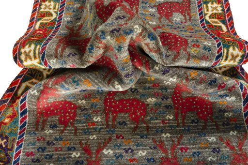 Corner detail of 2000s Persian Gabbeh rug showing border pattern and Wool pile