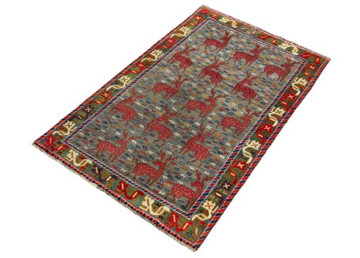 Corner detail of 2000s Persian Gabbeh rug showing border pattern and Wool pile