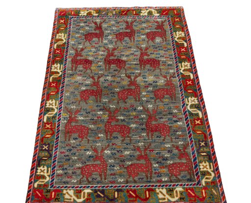 Surface texture of 2000s Persian Gabbeh rug with natural Wool and intricate pattern
