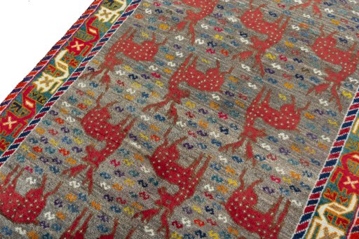 Backside of handmade 2000s Persian Gabbeh rug showing knot structure and weave density