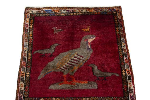 Surface texture of 1970s Persian Gabbeh rug with natural Wool and intricate pattern