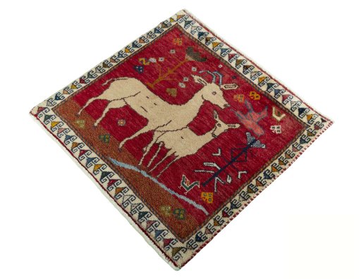 Corner detail of 1970s Persian Gabbeh rug showing border pattern and Wool pile