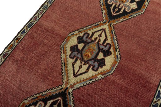 Backside of handmade 2000s Persian Gabbeh rug showing knot structure and weave density