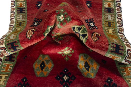 Corner detail of 2000s Persian Gabbeh rug showing border pattern and Wool pile