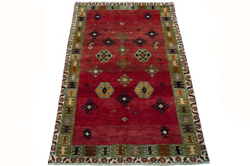Surface texture of 2000s Persian Gabbeh rug with natural Wool and intricate pattern