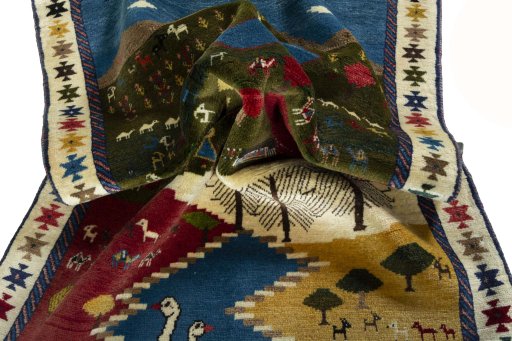 Corner detail of 2000s Persian Gabbeh rug showing border pattern and Wool pile