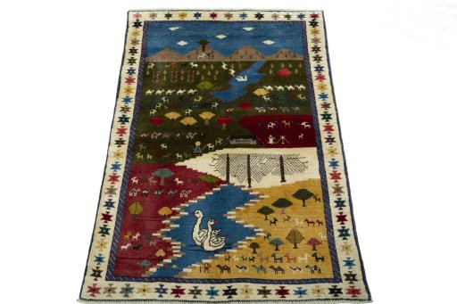Surface texture of 2000s Persian Gabbeh rug with natural Wool and intricate pattern