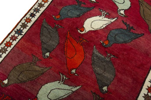 Backside of handmade 2000s Persian Gabbeh rug showing knot structure and weave density