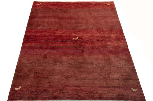 Surface texture of 2000s Persian Gabbeh rug with natural Wool and intricate pattern
