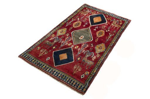 Corner detail of 2000s Persian Gabbeh rug showing border pattern and Wool pile