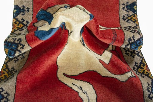 Corner detail of 2000s Persian Gabbeh rug showing border pattern and Wool pile