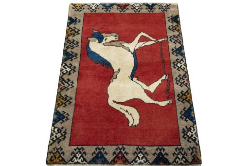 Surface texture of 2000s Persian Gabbeh rug with natural Wool and intricate pattern