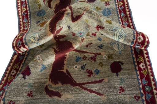 Corner detail of 2000s Persian Gabbeh rug showing border pattern and Wool pile