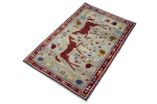 Corner detail of 2000s Persian Gabbeh rug showing border pattern and Wool pile