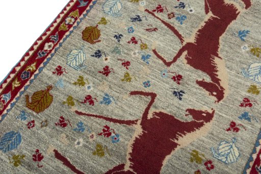 Backside of handmade 2000s Persian Gabbeh rug showing knot structure and weave density