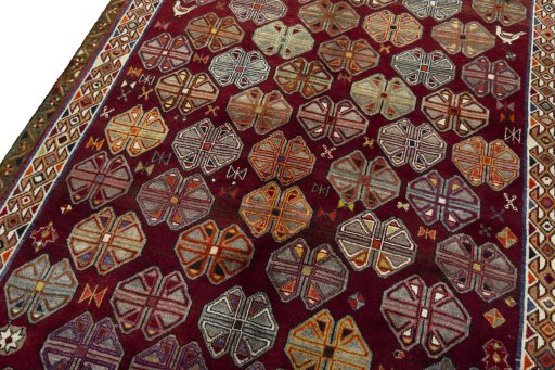 Backside of handmade 2000s Persian Gabbeh rug showing knot structure and weave density