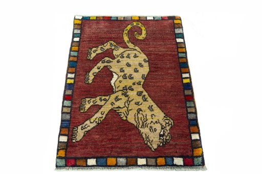 Surface texture of 2000s Persian Gabbeh rug with natural Wool and intricate pattern