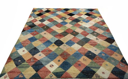 Surface texture of 2000s Persian Gabbeh rug with natural Wool and intricate pattern