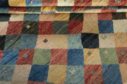 Full view of 2000s Persian Gabbeh rug from Iran / Persia, 224 × 198 cm in Multi Color tones