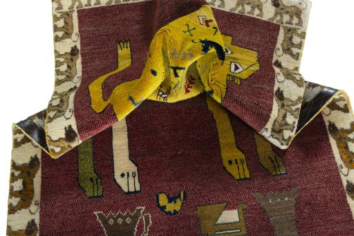 Corner detail of 2000s Persian Gabbeh rug showing border pattern and Wool pile