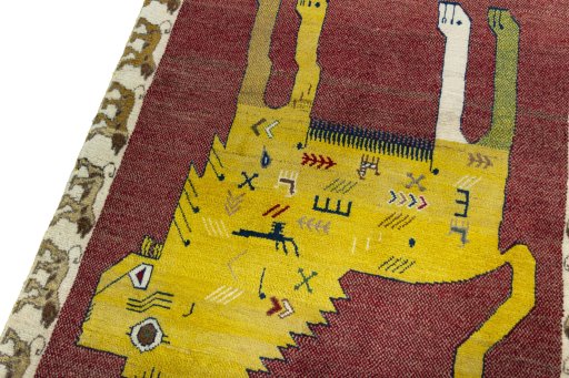 Backside of handmade 2000s Persian Gabbeh rug showing knot structure and weave density
