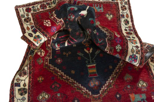 Corner detail of 2000s Persian Gabbeh rug showing border pattern and Wool pile