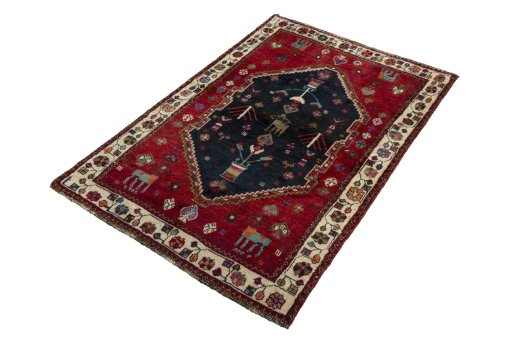 Corner detail of 2000s Persian Gabbeh rug showing border pattern and Wool pile