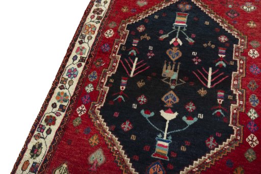 Backside of handmade 2000s Persian Gabbeh rug showing knot structure and weave density
