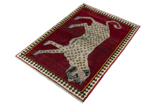 Corner detail of 2000s Persian Gabbeh rug showing border pattern and Wool pile