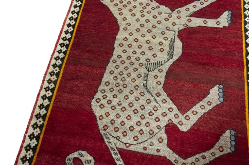 Backside of handmade 2000s Persian Gabbeh rug showing knot structure and weave density