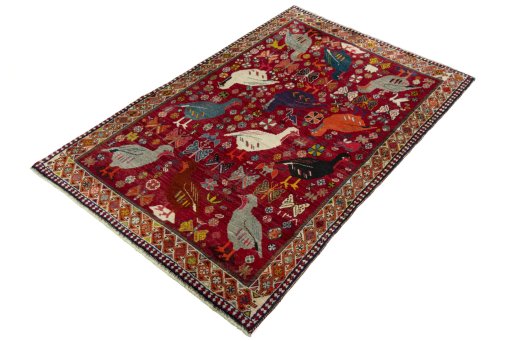 Corner detail of 2000s Persian Gabbeh rug showing border pattern and Wool pile