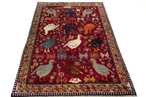 Surface texture of 2000s Persian Gabbeh rug with natural Wool and intricate pattern